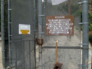 Unofficial-looking, hand-made signs on the Pinecrest Gate